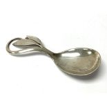 An Arts & Crafts Danish silver caddy spoon with As