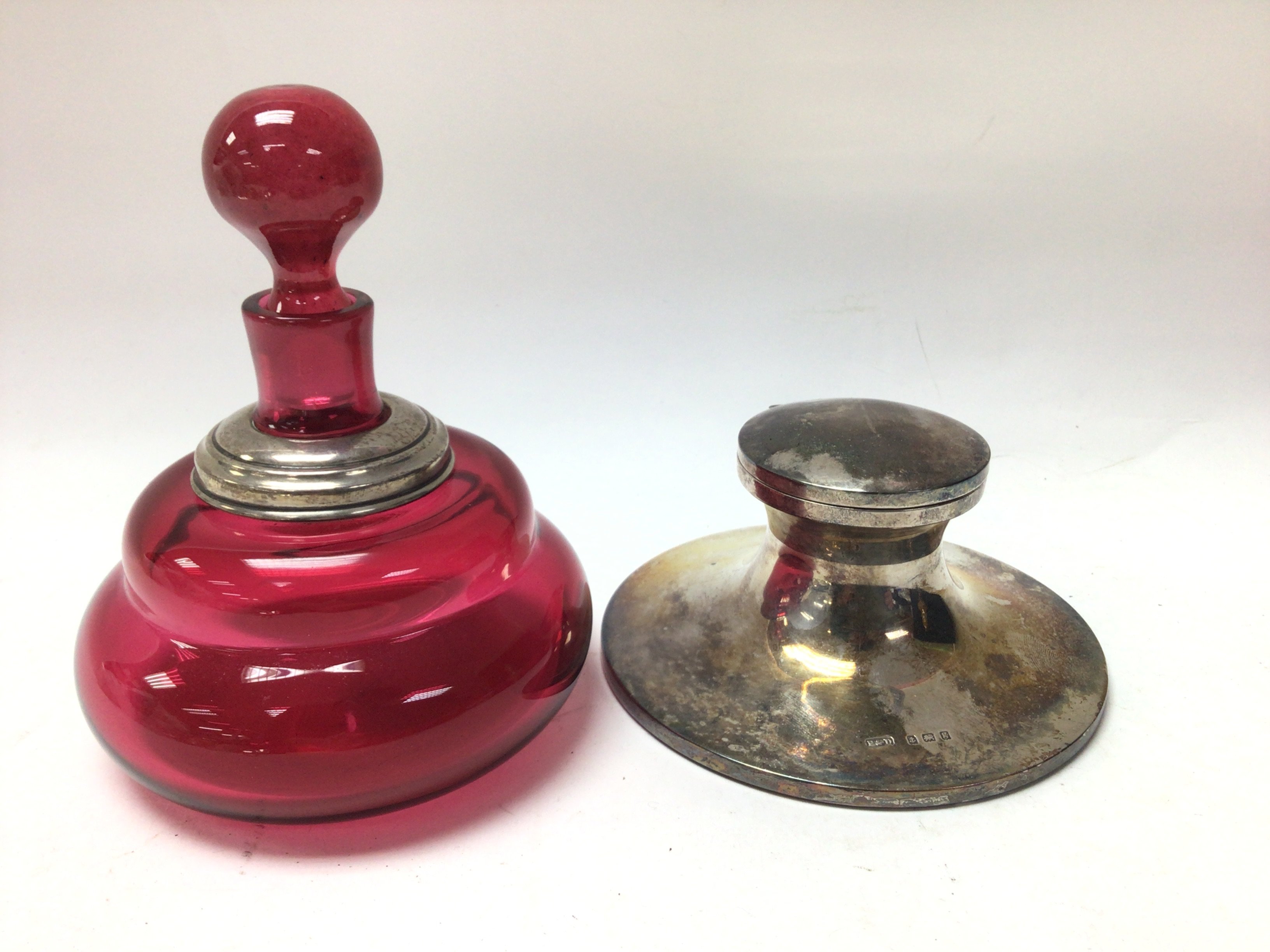 A hallmarked silver capstan inkwell together with