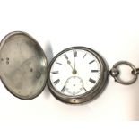 A silver pocket watch with silver chain. Not seen