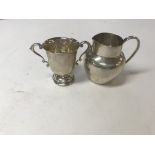 A silver creamer + trophy ( 106 grams )