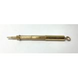 A 9ct gold telescopic propelling pencil engraved w