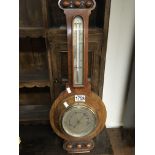 A walnut cased barometer length 62cm
