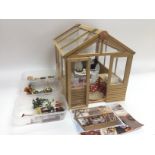 A model of a summerhouse with accessories. Approx