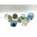 A collection of glass paper weights. Shipping cate