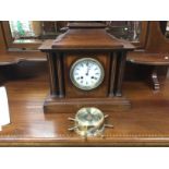 An Edwardian inlaid mahogany mantle clock and a small brass cased wall barometer (2). Shipping