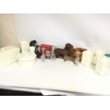 A collection of ceramics including dog figures by