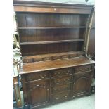 A Quality oak dresser with a raised back above sev