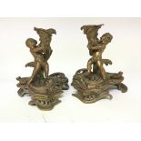 A pair of French bronze and partially gilded candl