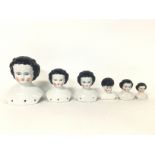 Ceramic doll heads, no obvious signs of restoratio