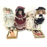 A collection of assorted dolls including porcelain
