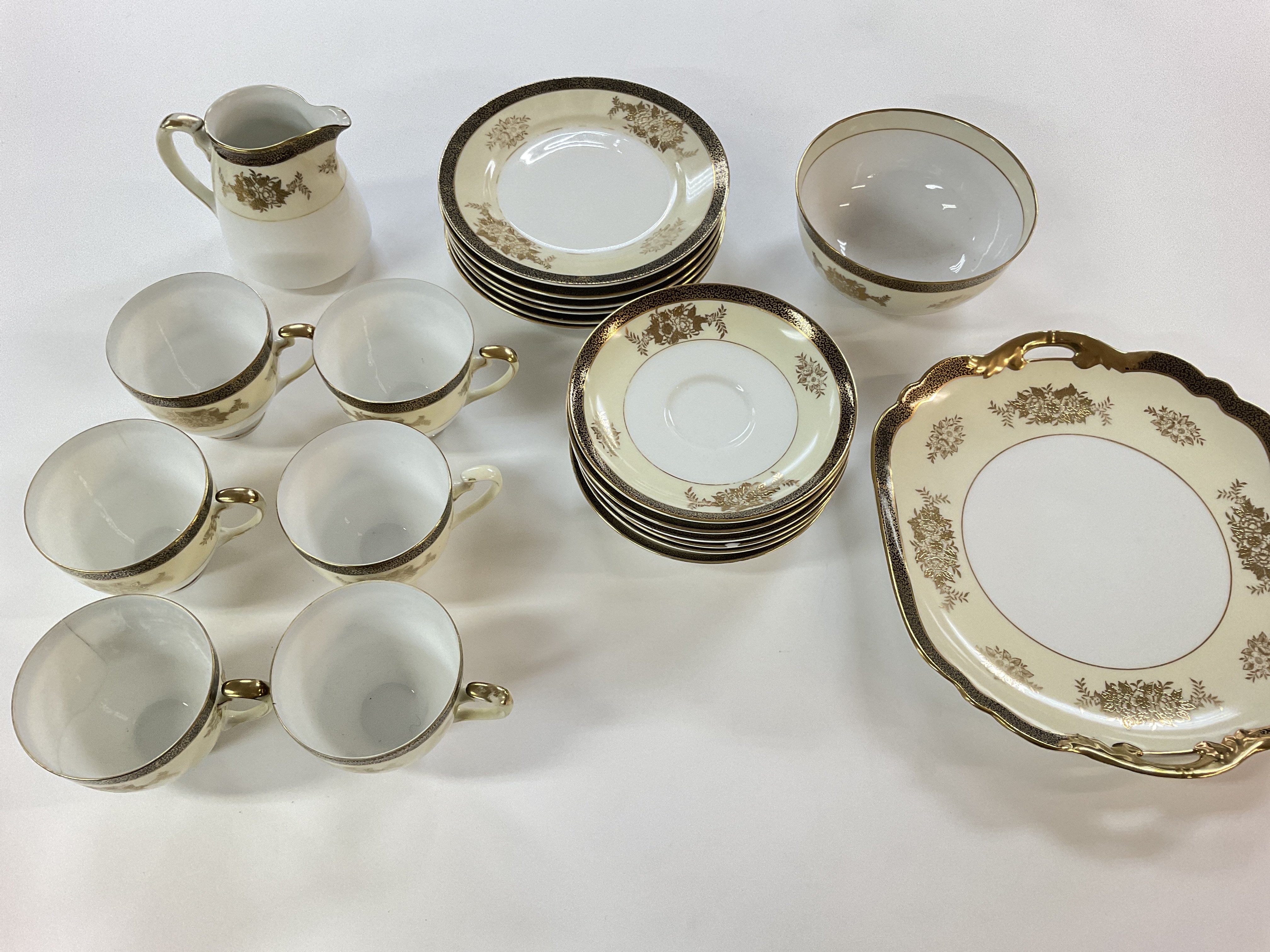 A Noritake tea set. There is damage to three of th