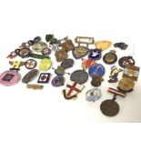 A collection of Vintage pin badges including Butli