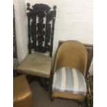 A carved oak Victorian chair with a raised back a Lloyd Loom chair an oak office type chair and