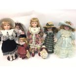A collection of various modern porcelain dolls inc