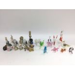 A collection of Wade Disney figures, glass animals, Royal Osborne ceramic animals etc. Shipping