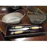 Cased antique carving set with two silver plated b