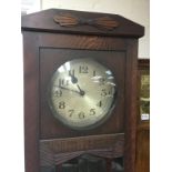 A circa 1920s oak longcase clock with Art Deco inf