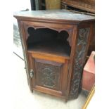 A George III carved corner cabinet, approx height 84cm. Shipping category D.