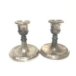 A pair of Birmingham silver Hallmarked loaded base candle sticks.