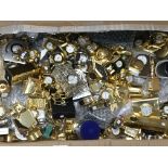 A large collection of miniature brass clocks and o