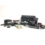 Various cased vintage cameras including a Praktica