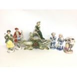 A collection of early 20th century ceramic figures