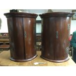 A pair of small mahogany corner cabinets, approx height 56cm. Shipping category D.