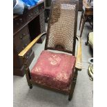 A beechwood occasional open arm chair with a patte