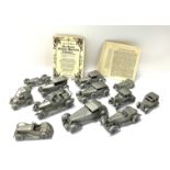 A collection of Danbury Mint pewter car models. (1