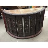 An Indonesian desk of semi circular shape the top