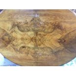 A Victorian burr walnut tip action dining table with an oval top. Shipping category D.