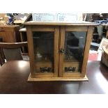 Oak smokers cabinet with a tin of cigars, Shipping