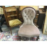 A Victorian button back chair plus one other dining chair. Shipping category D.