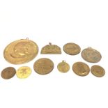 A collection of assorted medallions. Postage B