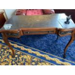 A 19th Century style French desk with leather top