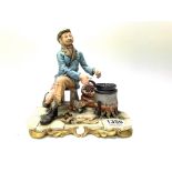 A Capodimonte porcelain figure of a tramp cooking