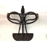 A metal stick stand 77cm tall by 46cm wide. Comes