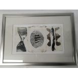 A framed contemporary wood block print layer on pa