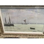A framed oil on board depicting barges by Hugh Bro