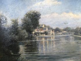 A gilt framed oil painting a view of village and a