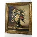 A framed oil painting still life study of flowers