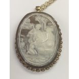 A cameo pendant inset in a 9 ct gold mount with at