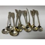 Twelve 19th Century condiment spoons (ten with monogrammed handles) all Fiddle Pattern and all