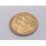 A George V gold half sovereign dated 1906.