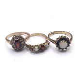 Three 9carat gold rings set with Opal and garnets