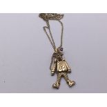 A 9carat gold articulating clown pendent with atta