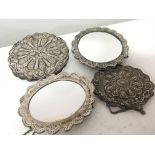 Four white metal framed mirrors of oval patterned