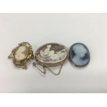 Three cameo brooches of classic influences.