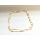 A natural Pearl necklace which is 60cm long. Posta