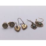 Three pairs of gold earrings set with chip stone d